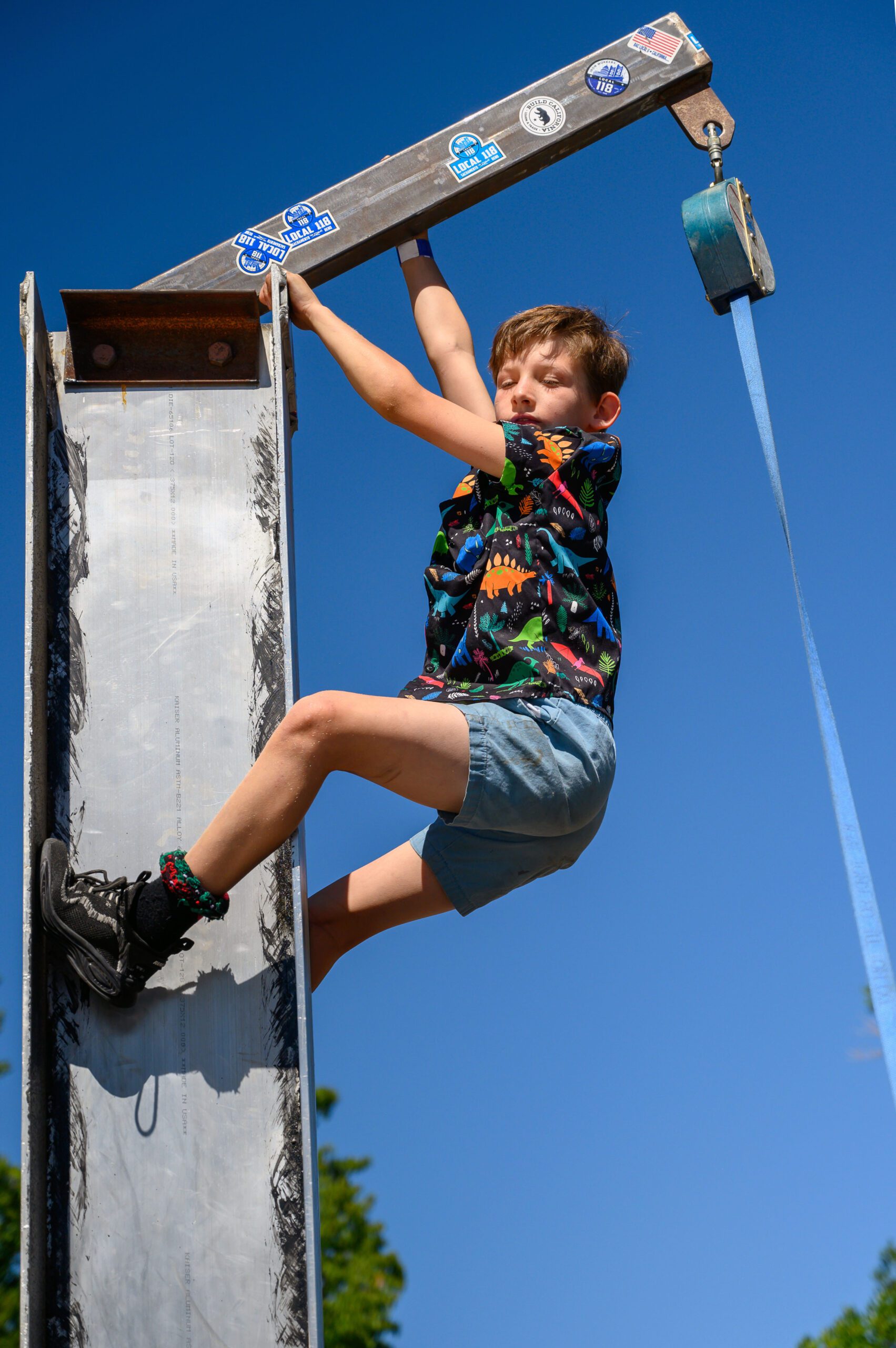 A child climbing an iron beam