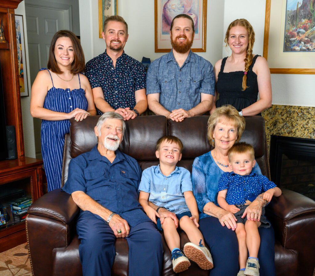 A family posing for a portrait in a living room
