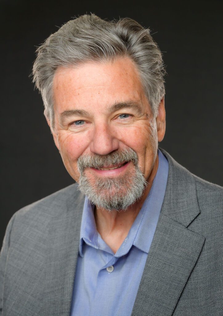 A man posing in a portrait studio