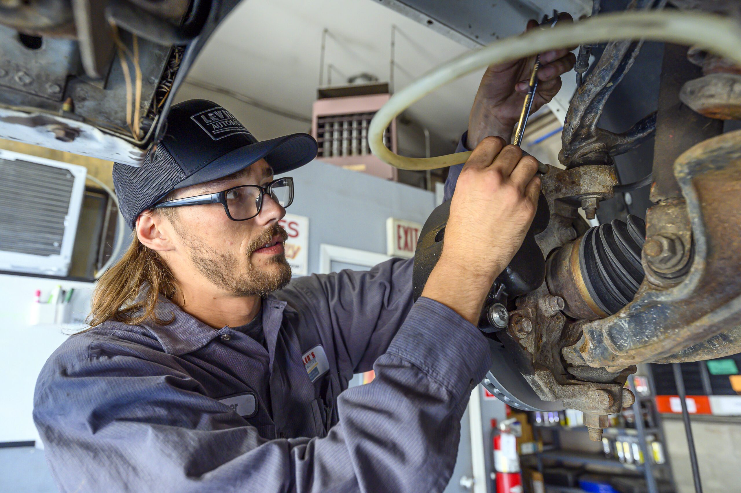 echanic working under hood at Allen's Automotive Sparks Nevada location